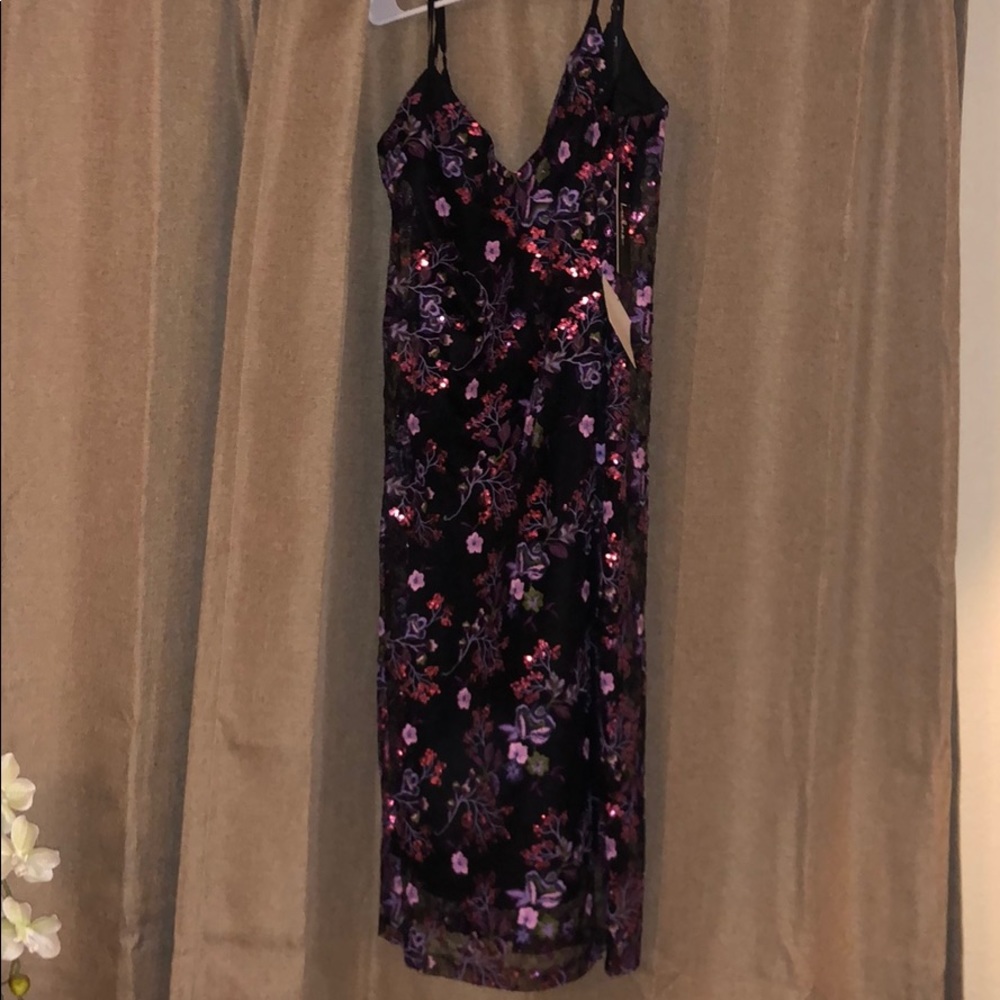 Embellished floral over the knee dress.